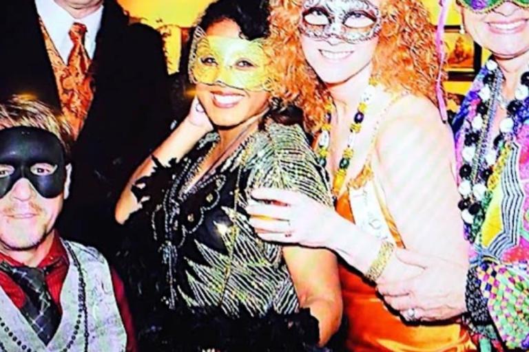 People in mardi gras masks
