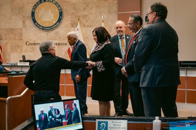 Supervisor Karen Spiegel shaking hands with Tim Evans