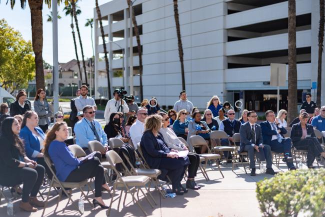 Audience members at the flag raising ceremony