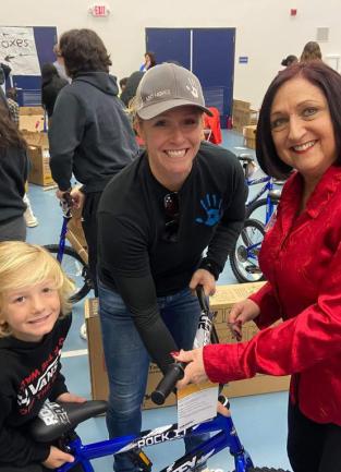 Supervisor Karen Spiegel volunteering at Bicycles for Children