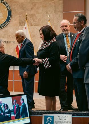 Supervisor Karen Spiegel shaking hands with Tim Evans