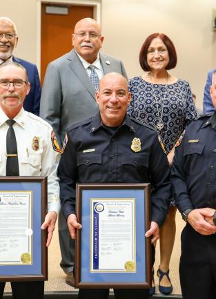 Awarding Division Chief John Crater and Battalion Chief Michael Martinez 